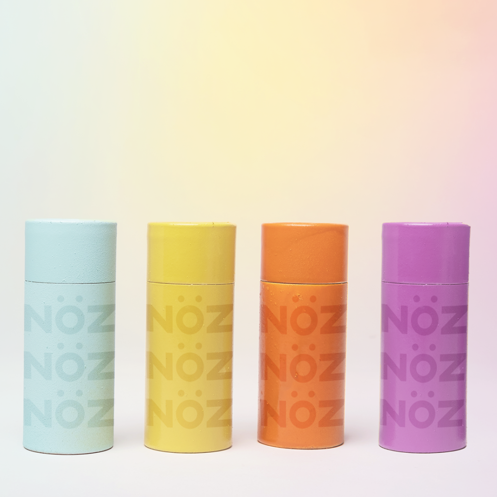 Nöz sunscreen that is available in blue, yellow, orange, and purple. 